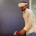 A user is playing virtual reality cricket game, Final Overs, using VR Pro Cricket Bat